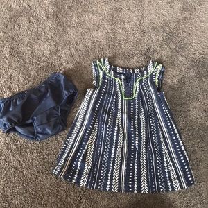 Blue and white dress with lime green stitching.